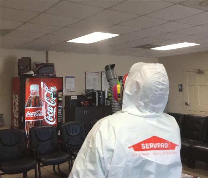 SERVPRO employee fogging a waiting room